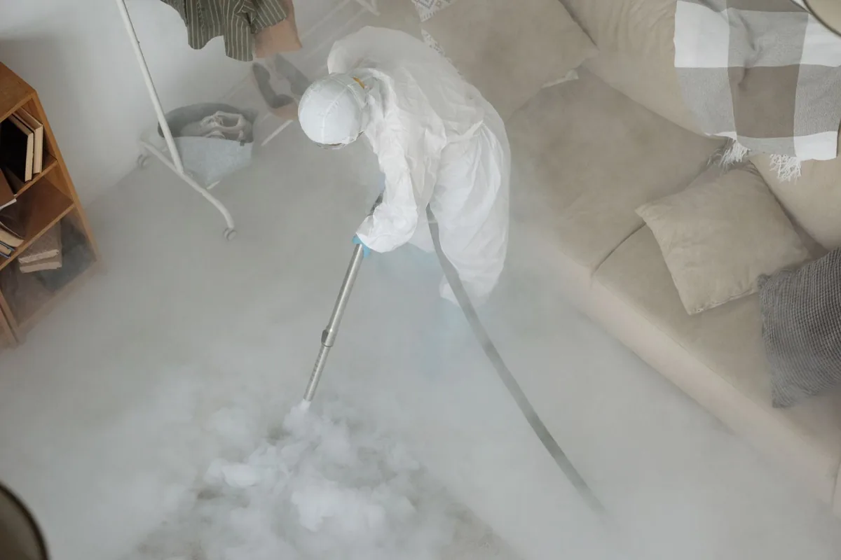Biohazard cleanup technician in protective equipment, California, PA